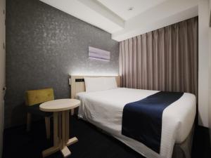 Postel nebo postele na pokoji v ubytování hotel MONday Premium TOYOSU