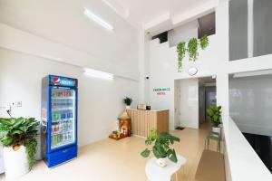 an office with a vending machine in a room at Thiên Quốc Hotel in Ho Chi Minh City