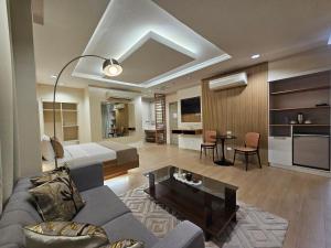a living room with a couch and a table at Hotel Nicanor in Dumaguete