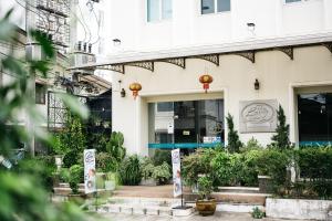 a building with signs in front of it at Niraxay Apartment in Vientiane