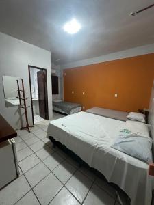 Katil atau katil-katil dalam bilik di Apto do Hotel Rio Preguiça