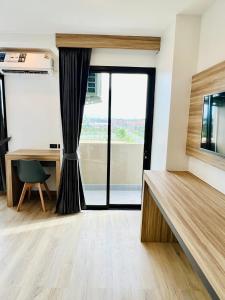 Kuchyň nebo kuchyňský kout v ubytování เวลโกรว์ โฮเทล - Wellgrow Hotel