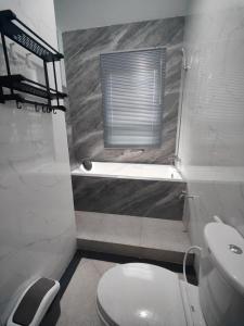 Ένα μπάνιο στο House Of Elea SYARIAH