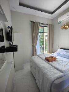 Ένα ή περισσότερα κρεβάτια σε δωμάτιο στο House Of Elea SYARIAH