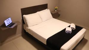 Hotel Simón Plaza房間的床