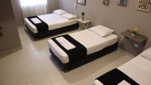 Hotel Simón Plaza房間的床