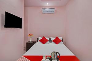 Postel nebo postele na pokoji v ubytování Hotel O R K Guest House + 29 fotografií