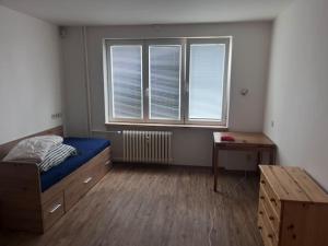 Postel nebo postele na pokoji v ubytování 3kk - centrum Havířova