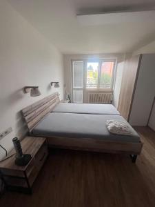Postel nebo postele na pokoji v ubytování 3kk - centrum Havířova