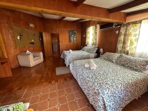 Rúm í herbergi á Hare Henua Bed & Breakfast