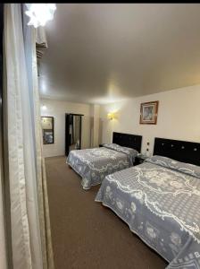 Postel nebo postele na pokoji v ubytování Hotel Novo