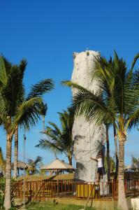 a woman standing in front of a rock face at Occidental Caribe - All Inclusive in Punta Cana