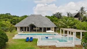 an image of a villa with a swimming pool at Qambani Luxury Resort in Michamvi