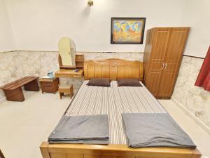 Postel nebo postele na pokoji v ubytování Sree Laxmi Vilas