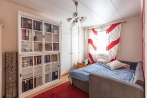 a bedroom with a bed and a window at Villa Repo in Rovaniemi