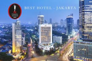 a view of a city skyline at night at Mandarin Oriental, Jakarta in Jakarta