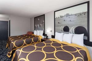 Voodi või voodid majutusasutuse Super 8 by Wyndham Olney toas
