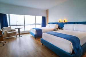 Postel nebo postele na pokoji v ubytování Wyndham Guayaquil, Puerto Santa Ana