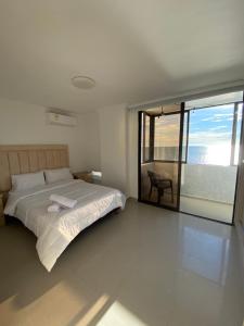 Postel nebo postele na pokoji v ubytování LIVING CARTAGENA Apto de lujo