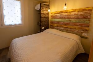 A bed or beds in a room at Camping Camplani