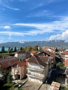 a view of a city with houses and mountains at Oasis in Struga