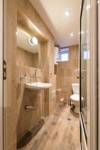 a bathroom with a sink and a toilet at Stylish apartment, Top center! in Sofia