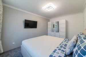 Кровать или кровати в номере Malena Apartments