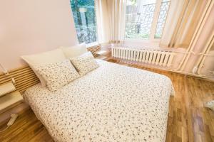 a bedroom with a bed and two pillows on it at Stylish apartment, Top center! in Sofia
