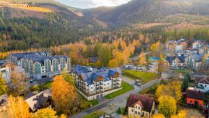 an aerial view of a town in the mountains at Wonder Home - Apartamenty z widokami i blisko szlaków - w spokojnej części Karpacza in Karpacz
