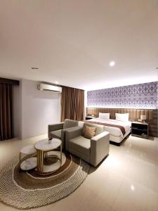 Postelja oz. postelje v sobi nastanitve SM Tower Hotel and Convention Berau