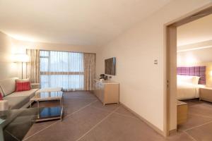 Voodi või voodid majutusasutuse Holiday Inn Golden Mile by IHG toas