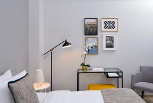 Ένα ή περισσότερα κρεβάτια σε δωμάτιο στο Maison Hotel