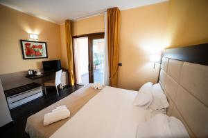 Postel nebo postele na pokoji v ubytování UNICO Cannamele Escape Tropea by Life Resorts