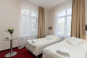 Postel nebo postele na pokoji v ubytování Modlin Palace