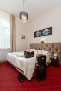 Postel nebo postele na pokoji v ubytování Modlin Palace