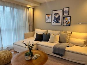 a living room with a couch and a table at Roppongi Place in Tokyo