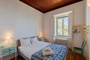 En eller flere senge i et værelse på Chalet Machado + 39 billeder