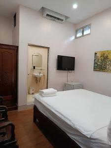 Voodi või voodid majutusasutuse Hanoi Carina Hotel toas