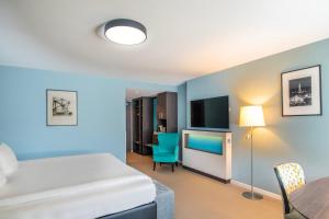 Katil atau katil-katil dalam bilik di Thon Hotel EU