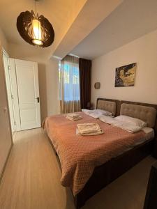 Postel nebo postele na pokoji v ubytování Verona Apartment