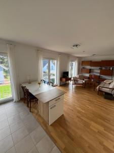 a large living room with a table and chairs at Buschwiesen Ausguck in Teltow