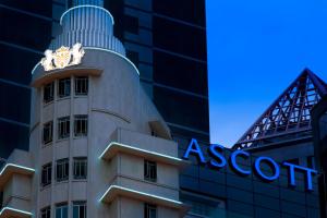 a building with a sign on the side of it at Ascott Raffles Place Singapore in Singapore