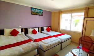 Postel nebo postele na pokoji v ubytování Hotel Tranquil