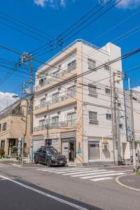 a car parked in front of a building at mori house西が丘 in Tokyo