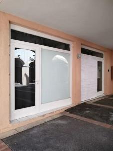 a garage with two large sliding doors on a building at Complexe Cap Esterel village ,vue mer studio avec parking in Agay - Saint Raphael +22 photos