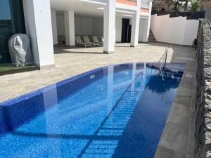 The swimming pool at or close to Amazing Duplex with panoramic ocean views