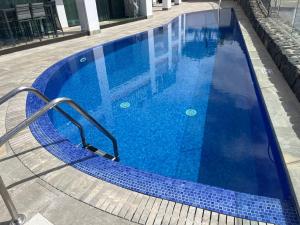 The swimming pool at or close to Amazing Duplex with panoramic ocean views