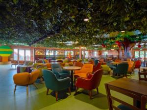 a restaurant with colorful chairs and tables at LEGOLAND(R) Windsor Resort in Windsor