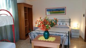Postel nebo postele na pokoji v ubytování Bed&Breakfast L'Oasi