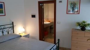Postel nebo postele na pokoji v ubytování Bed&Breakfast L'Oasi